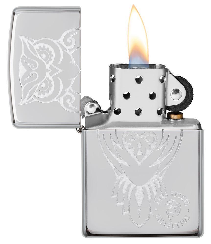 Anne Stokes Owl design High Polish Chrome windproof lighter with its lid open and lit