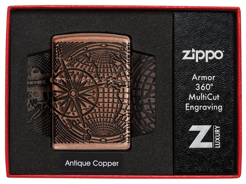 Vue de face briquet Zippo Armor Antique Copper Multi Cut avec gravure carte du monde dans un élégant emballage ouvert