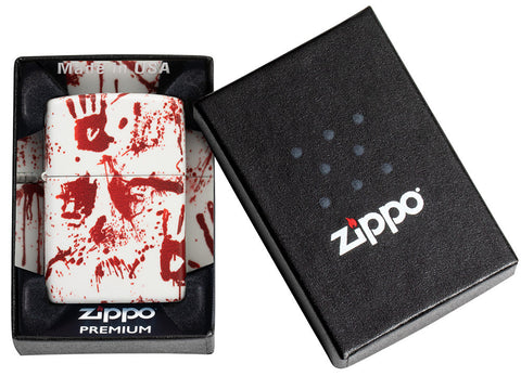 Encendedor Zippo 540 grados de diseño blanco mate con huellas de manos ensangrentadas en embalaje premium abierto