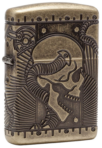 Vue de face 3/4 briquet Zippo laiton antique avec gravure profonde tête de mort et éléMen,ts mécaniques