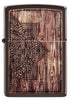 Vue de face briquet Zippo motif mandala marron clair sur arrière-plan en bois